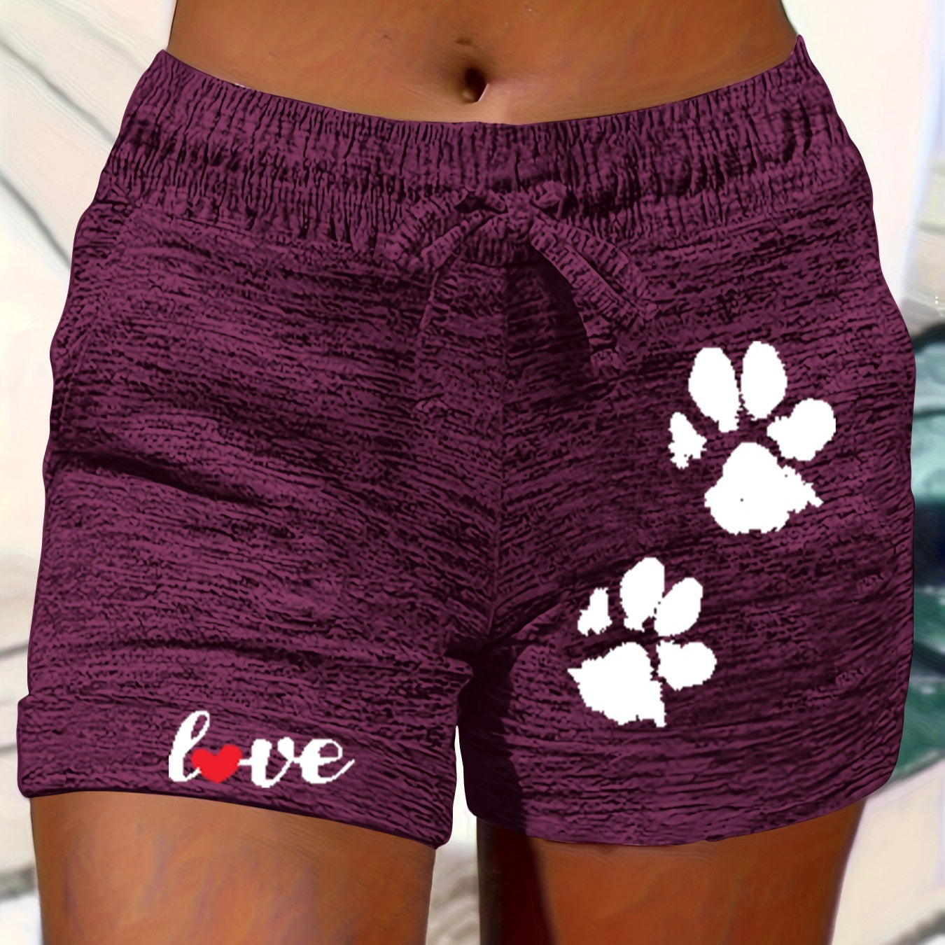 Women's printed elastic waist cropped shorts with pockets, casualwear by Plush Fashion Hub, featuring a colorful floral pattern.