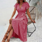 Flowy summer floral boho maxi dress with short sleeves and ruffle details by FitiqueFit, perfect casualwear for warm weather.