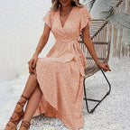 Flowy boho maxi dress with short sleeves and ruffle details, perfect for summer casualwear by FitiqueFit.