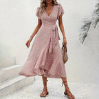 Flowy summer floral boho dress by FitiqueFit featuring short sleeves, ruffles, and a maxi length perfect for casual wear.
