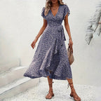 Flowy floral boho summer dress by FitiqueFit featuring short sleeves, ruffles, and a maxi length for casual wear.