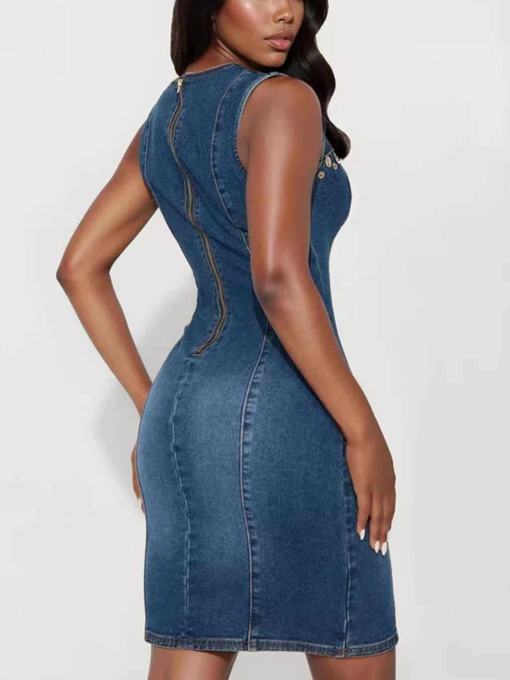 Sleeveless denim dress with embellishments and cutout details, Trendsi women’s fashion dress displayed on a hanger.