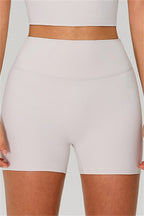 Fitglutes activewear one-shoulder crop top and shorts 2-piece set, gymwear and sportswear for workout and fitness activities.