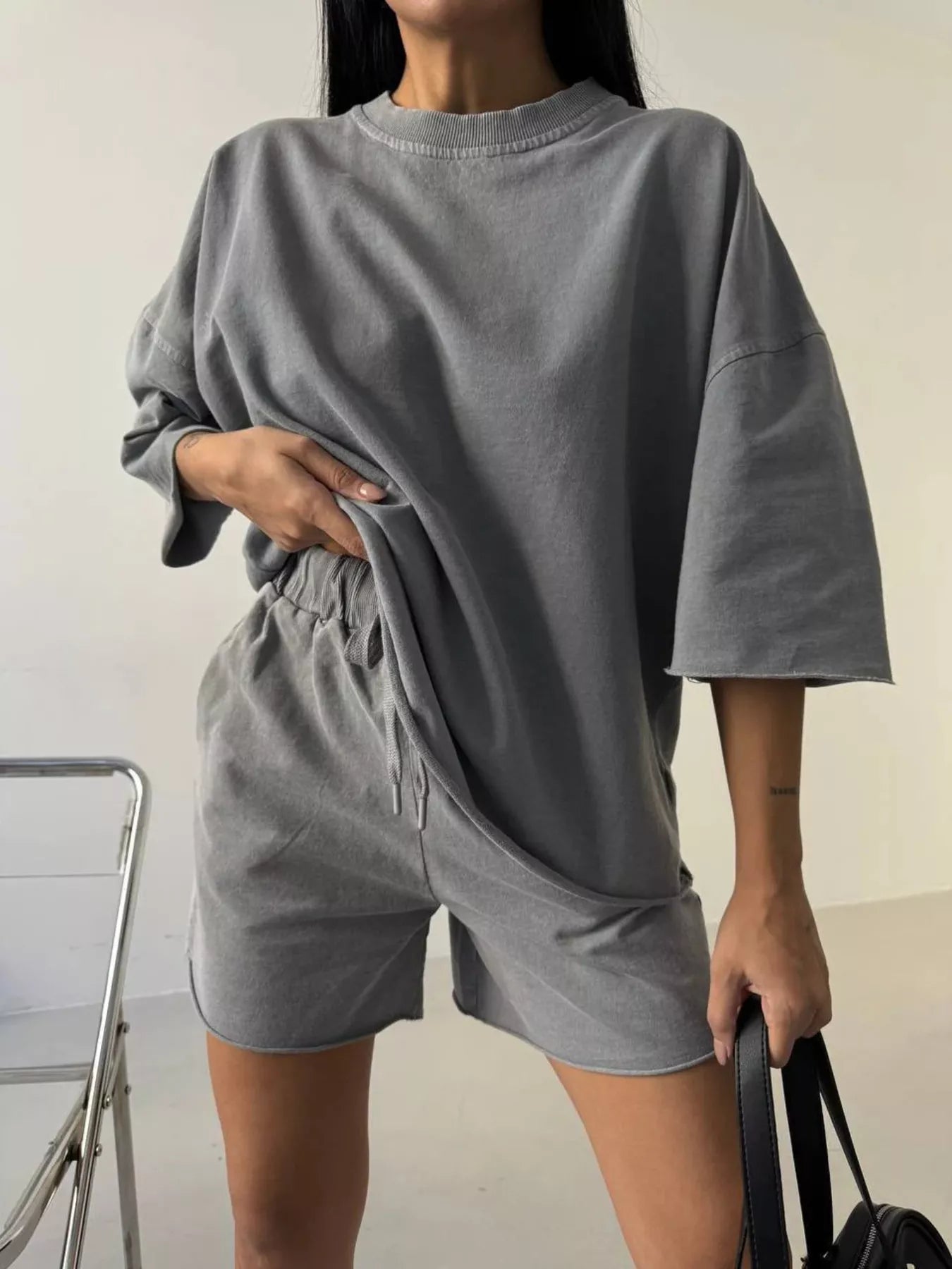 Vintage wash oversized lounge set with t-shirt and shorts from Trendsi, featuring a relaxed fit and casual style.