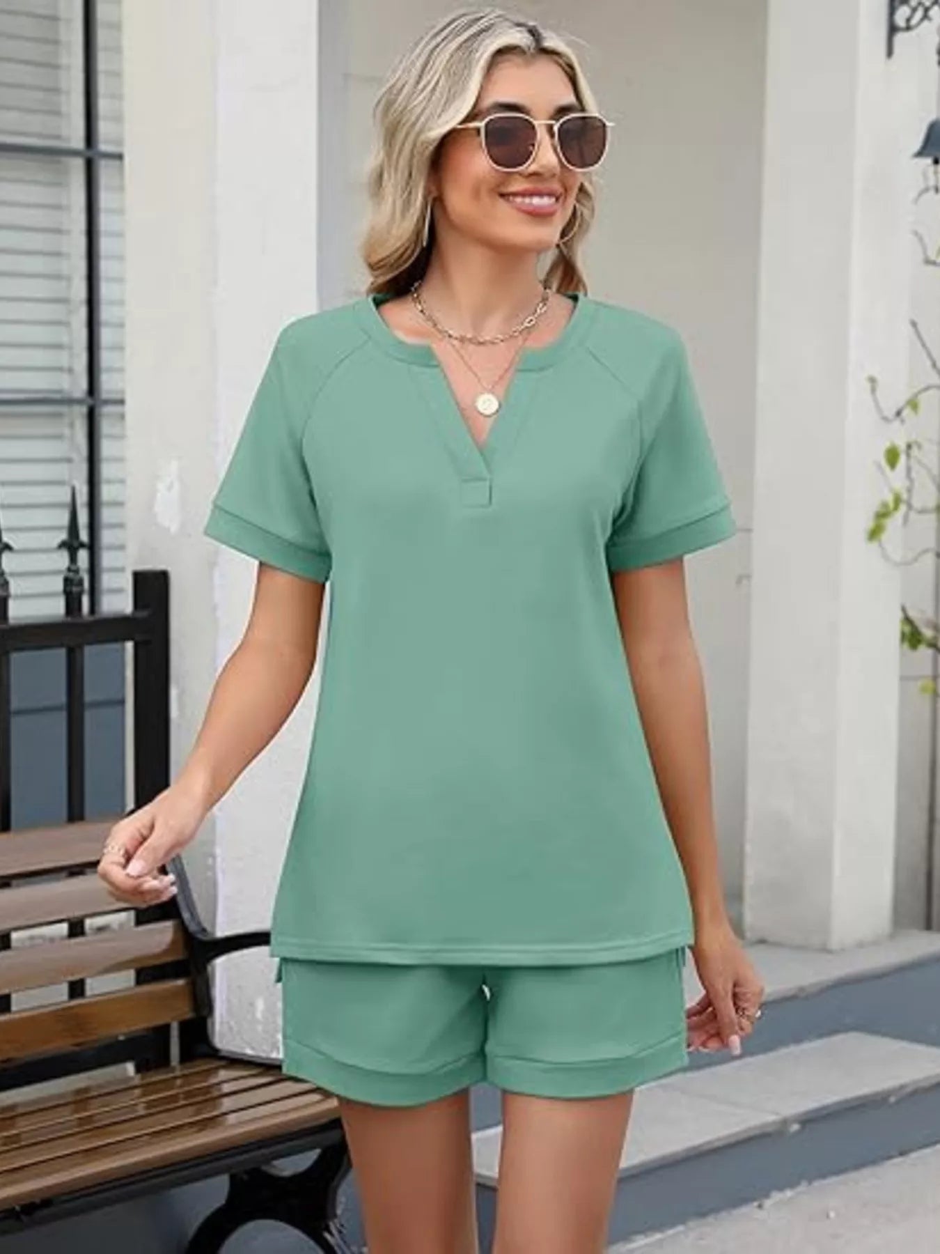 Solid color short sleeve top and matching shorts two-piece set by Trendsi, casual summer outfit in vibrant fabric.