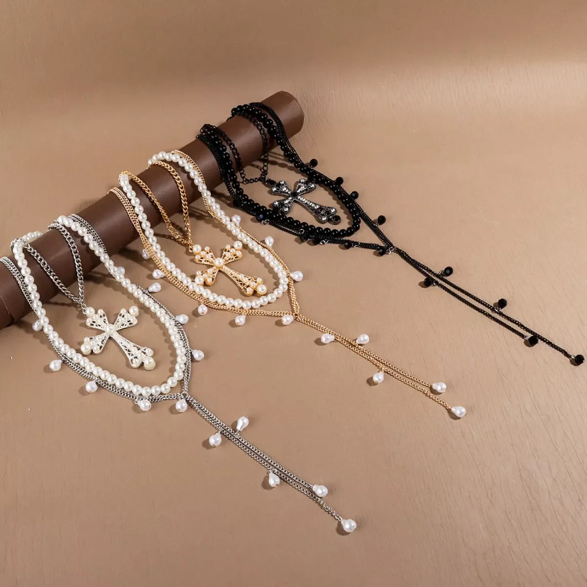 Set of three Pearl Cross Pendant Necklaces by Plush Fashion Hub featuring elegant pearl and cross designs on silver chains.