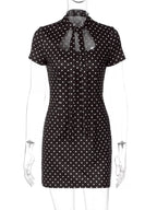 Polka dot cut-out front mini dress by Shopimist featuring a stylish design with a fitted silhouette and playful pattern.
