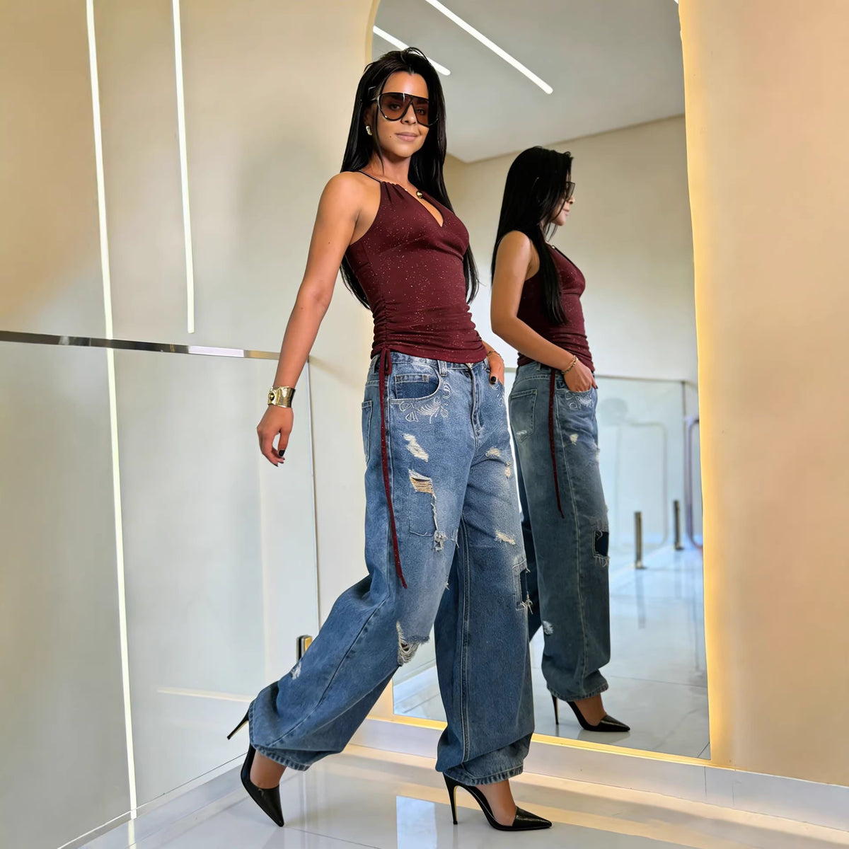 Pair of eprolo street style patched distressed washed skinny jeans with ripped details and a fitted silhouette.