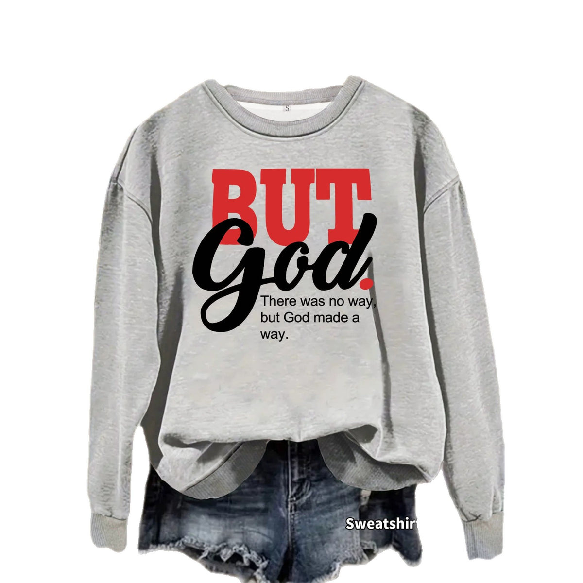 Heather grey crewneck sweatshirt with the words "BUT" in red block letters and "God" in black cursive.