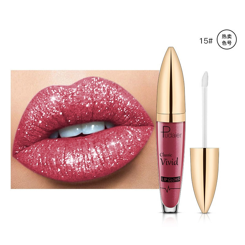 Sparkling pink lip gloss with gold and clear plastic tube, shown with matching applicator and glossy glitter lips swatch.