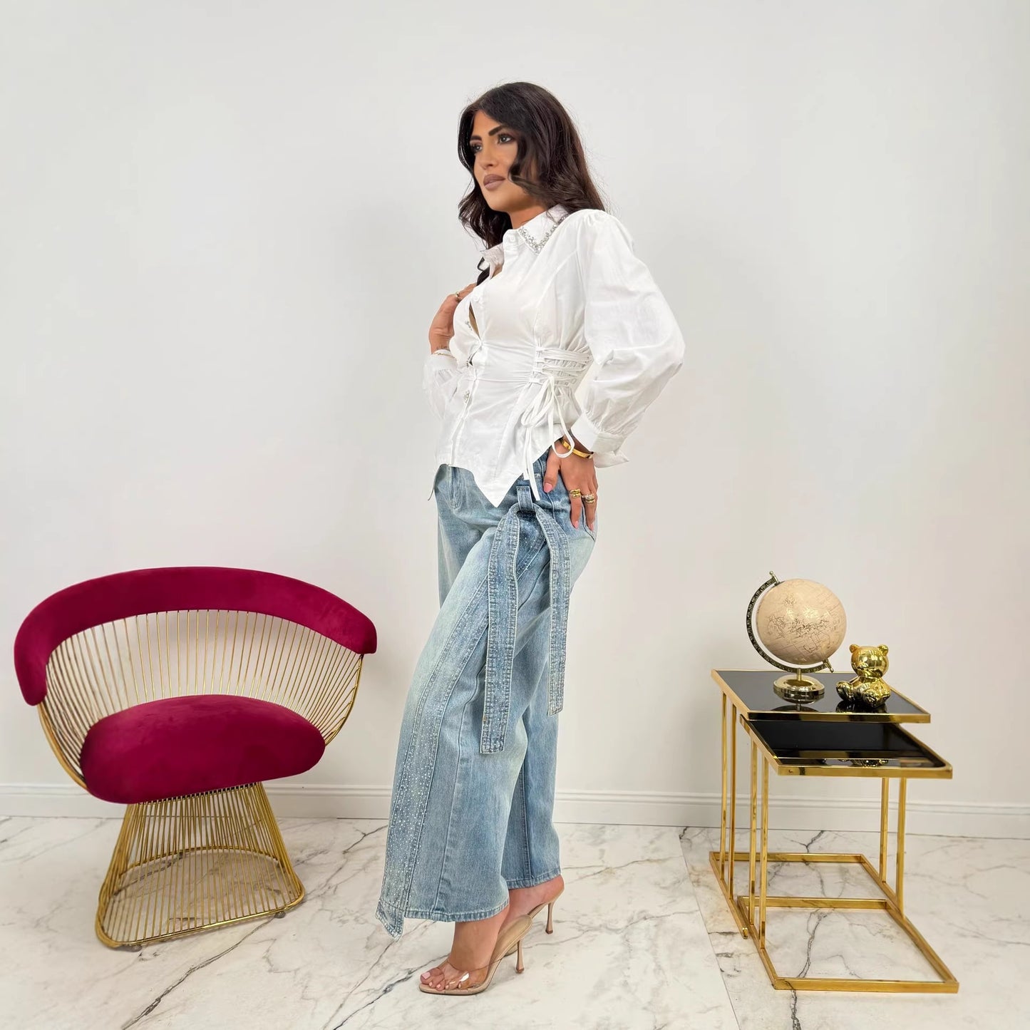 Washed denim jeans from Plush Fashion Hub featuring heavy rhinestone side bows and classic five-pocket design.