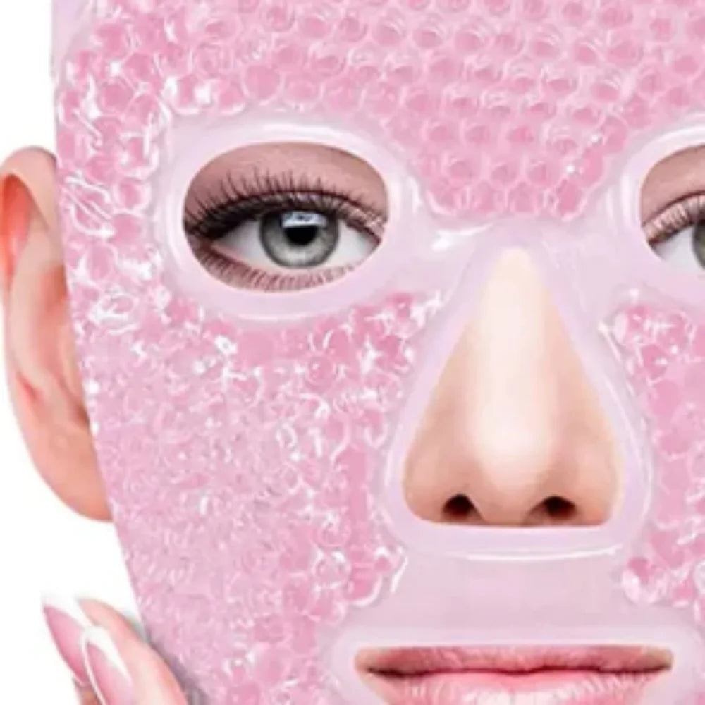 A pink gel bead face mask on a person's face, featuring a translucent beaded pattern and cutouts for eyes, nose, and mouth.