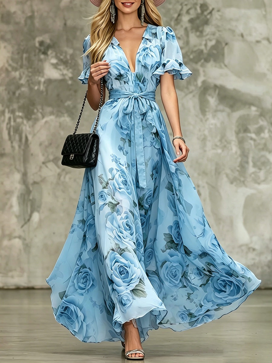 Women's deep V-neck ruffle sleeve printed maxi dress with high waist by Plush Fashion Hub, showcasing flowing fabric and vibrant print.