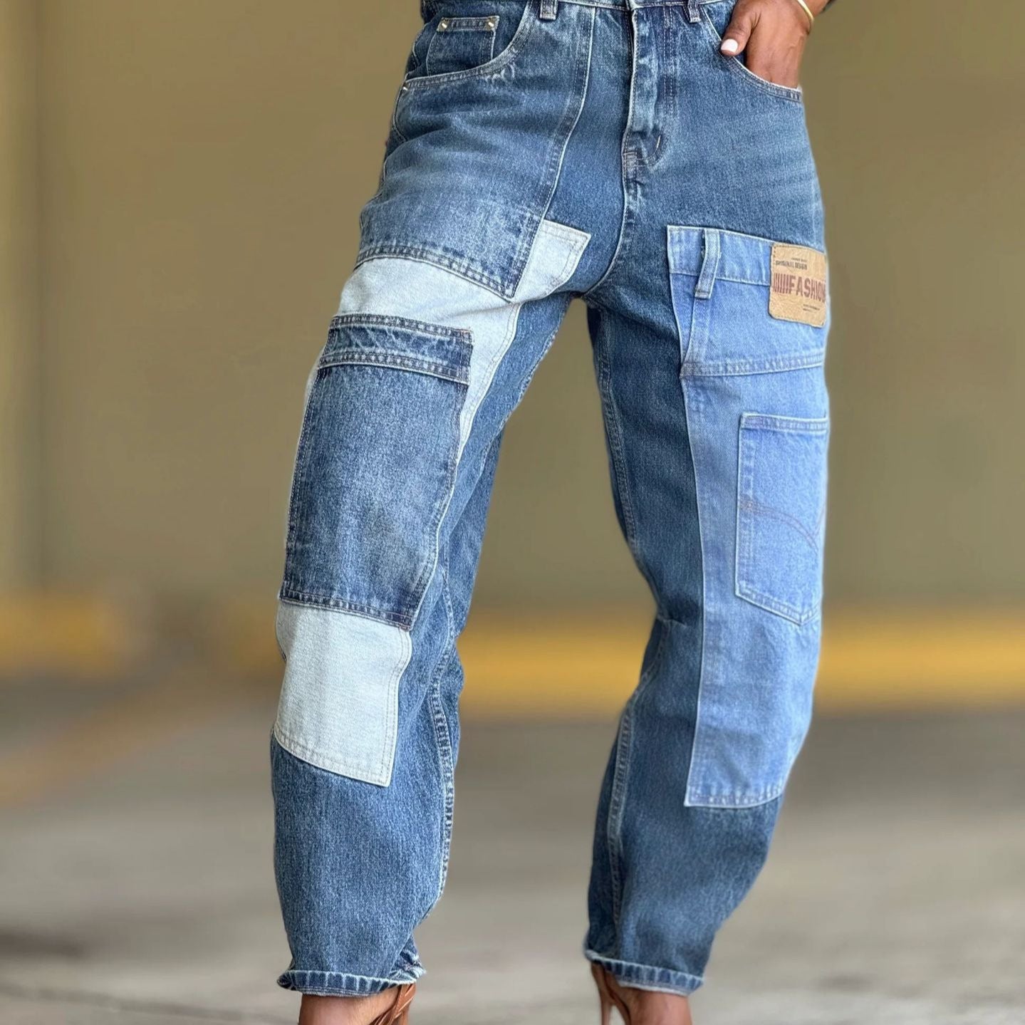 Deconstructed patchwork multicolor denim tapered jeans from Plush Fashion Hub with multiple pockets and distressed details.