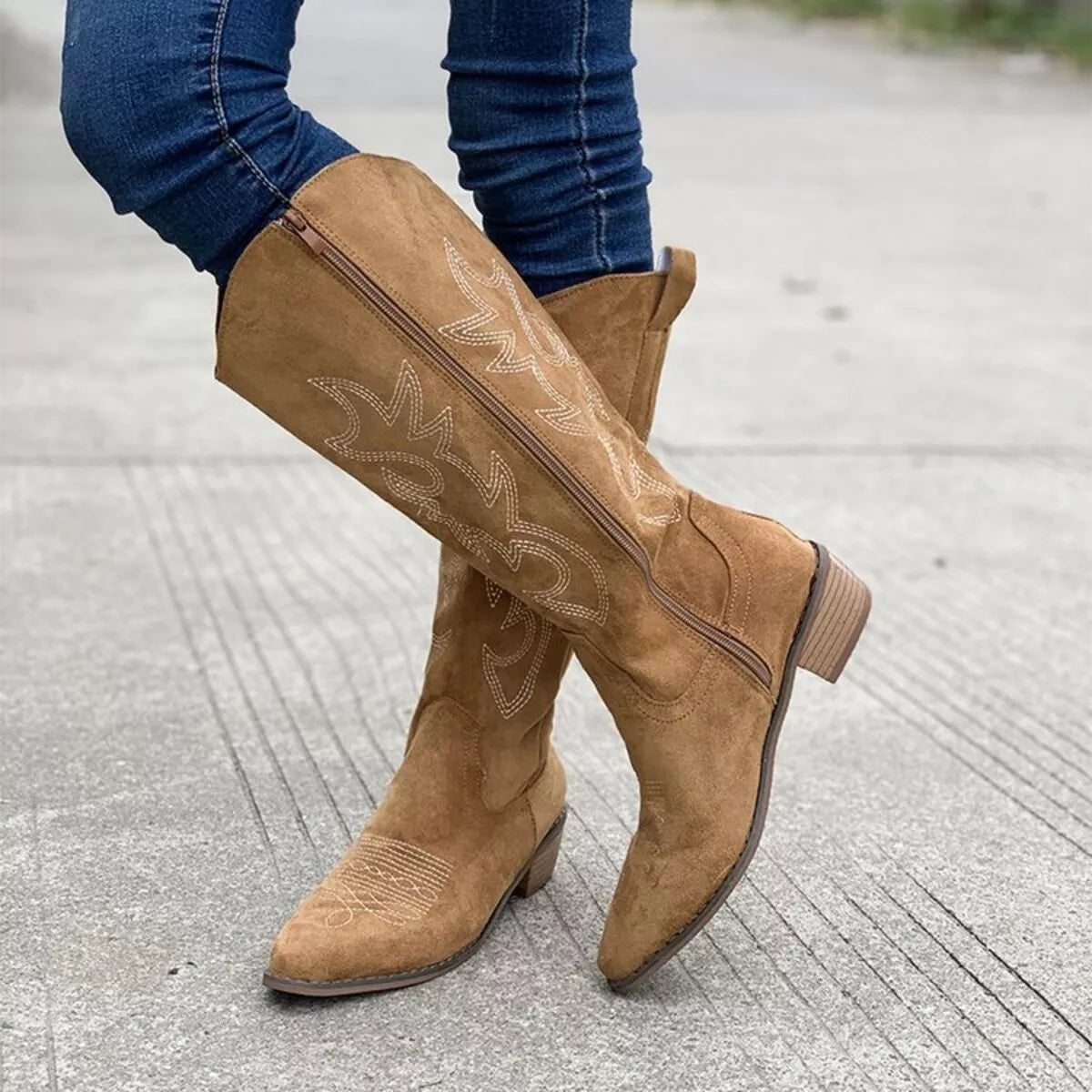 Point toe block heel boots in black leather, stylish women's footwear by Trendsi with a sleek silhouette and sturdy heel.