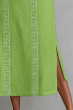 Women's sleeveless maxi dress with side slit and pockets by Plush Fashion Hub, featuring a flowy fabric and stylish design.