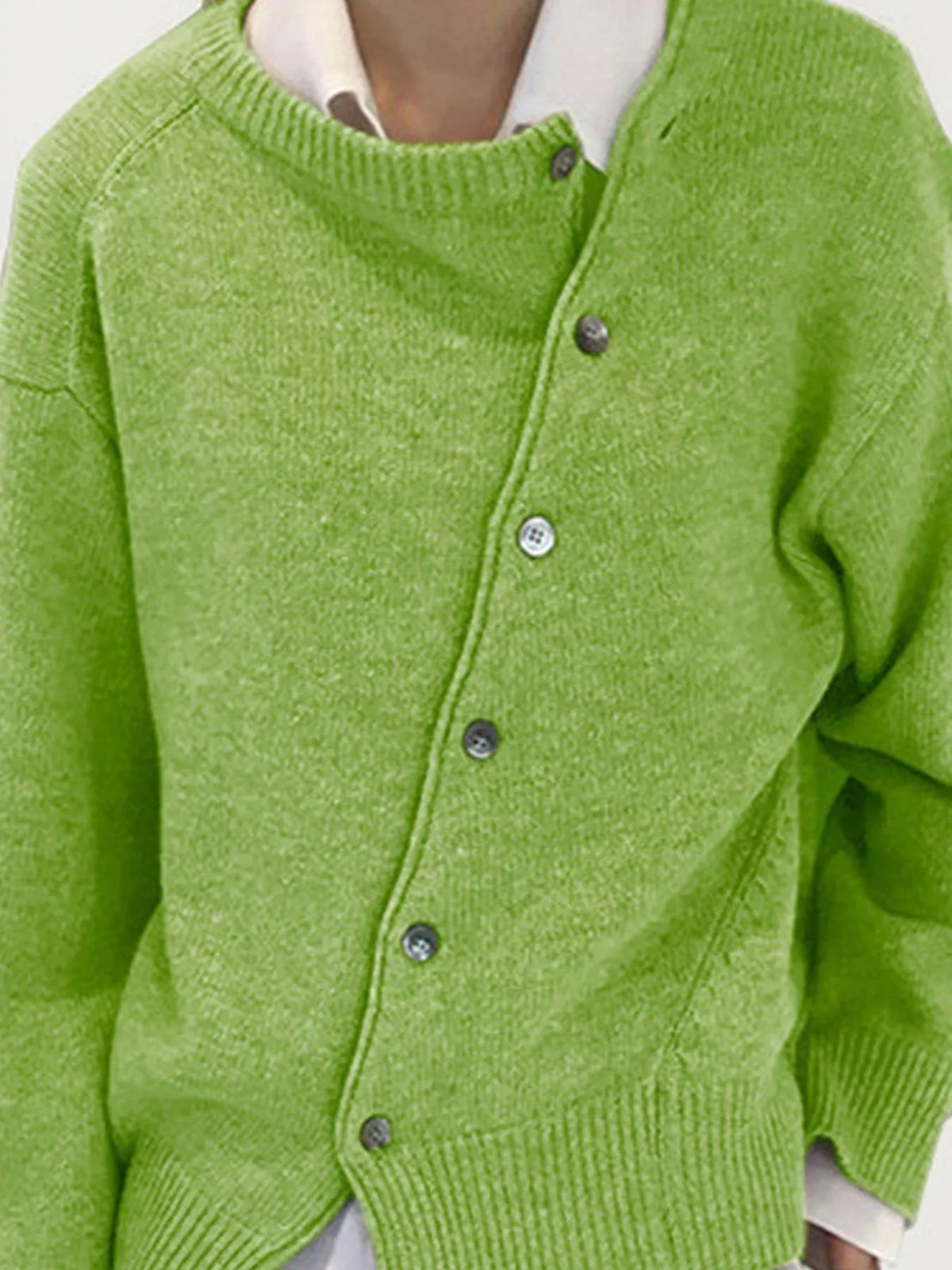 Asymmetric button-down sweater by Trendsi featuring a stylish, modern design with unique button placement and cozy knit fabric.