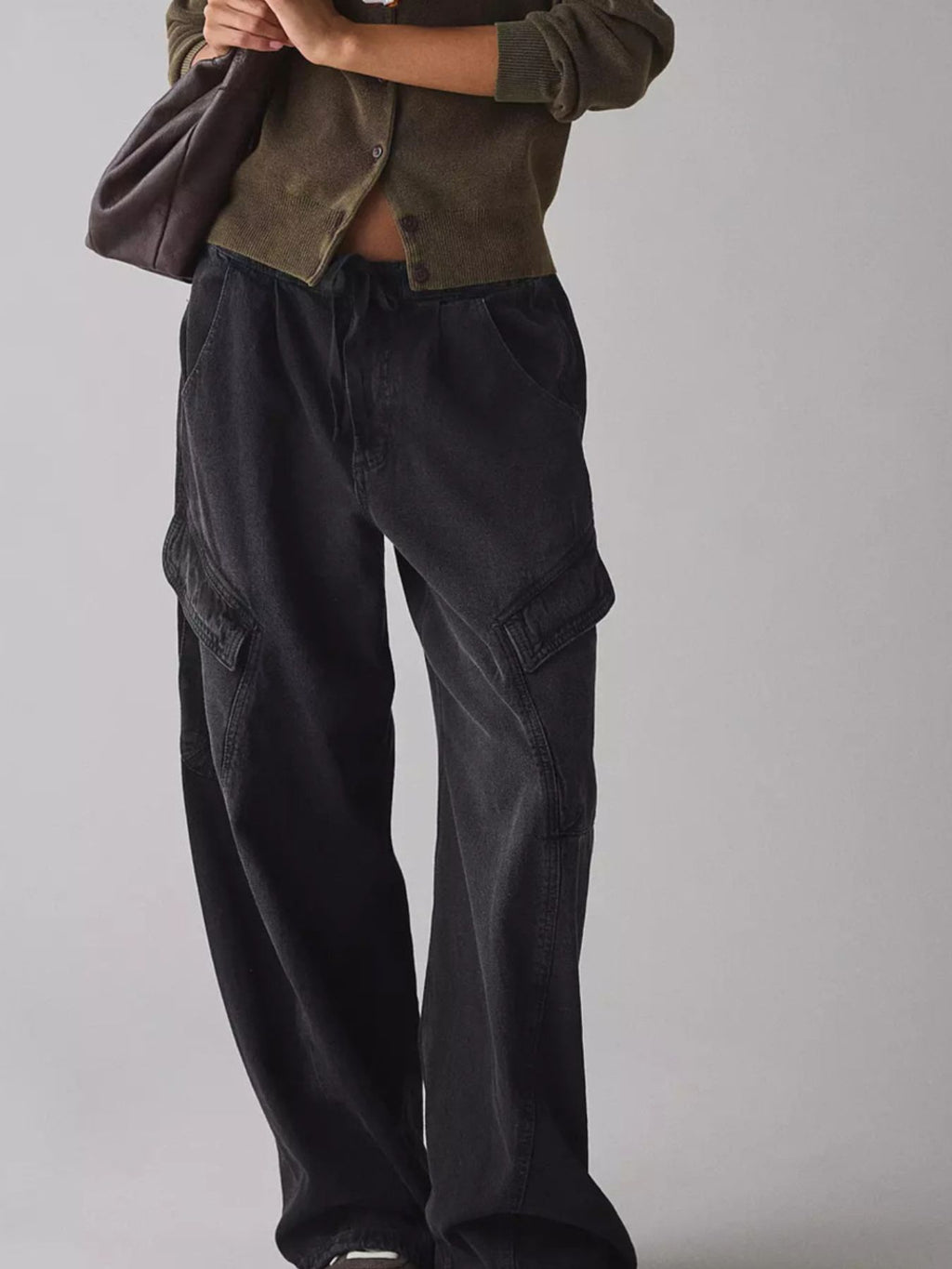 Women's relaxed fit cargo denim jeans with drawstring waist from Trendsi, featuring utility pockets and classic blue denim fabric.