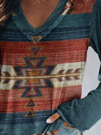 Plus size Trendsi geometric print V-neck long sleeve T-shirt, casual top with colorful geometric pattern and comfortable fit.
