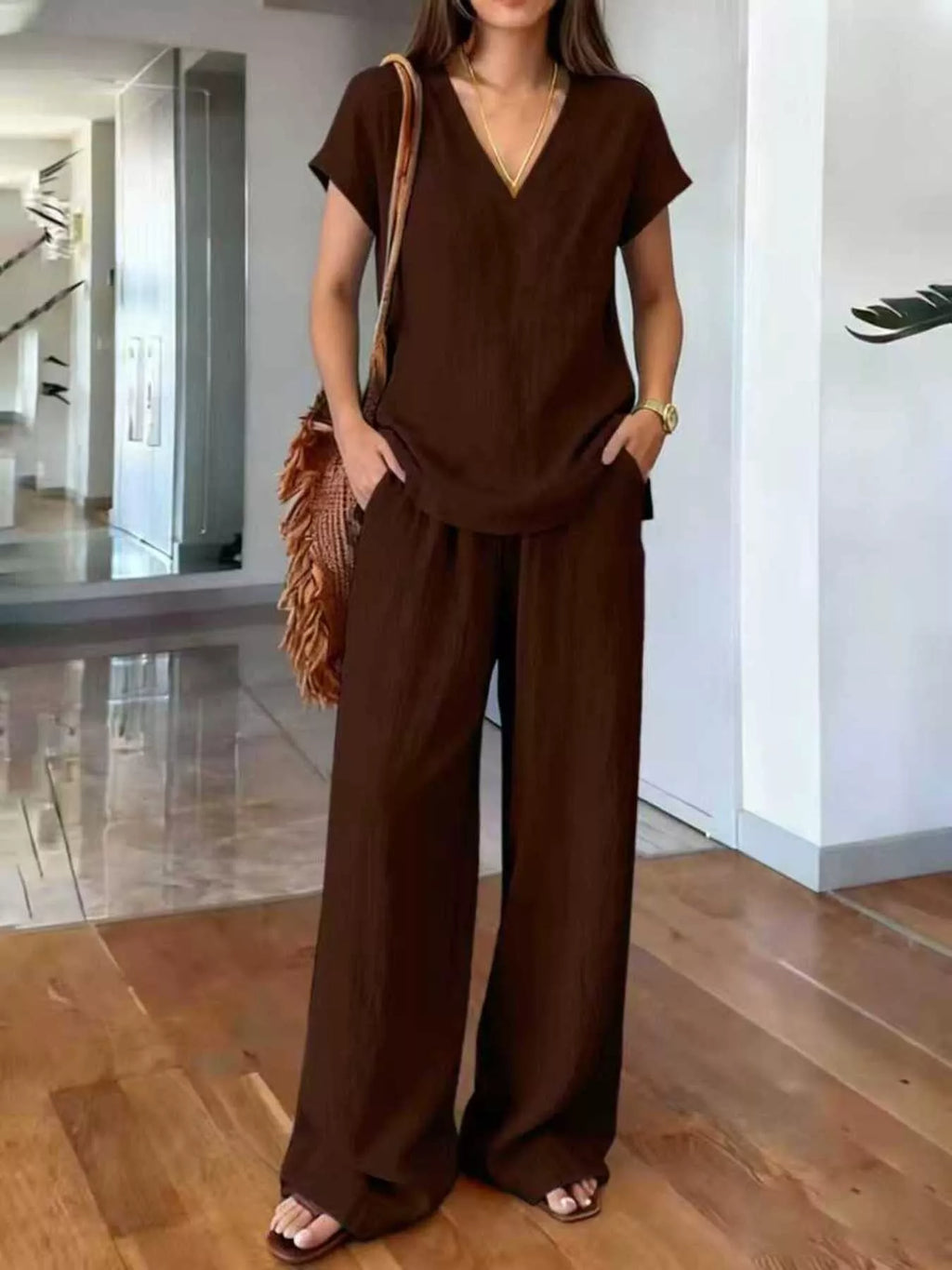Plus size Trendsi loungewear set with v-neck short sleeve top and matching pants, comfortable and stylish for relaxed wear.