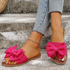 Flat sandals with bowknot embellishments from Plush Fashion Hub, featuring a stylish open-toe design and comfortable slip-on style.