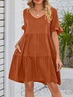 Lightweight rayon ruffled sleeve tiered mini dress with pockets, stylish and casual, ideal for warm-weather wear.