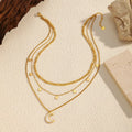 18K gold-plated moon three-layered necklace with delicate chains and celestial charms, stylish and elegant jewelry piece