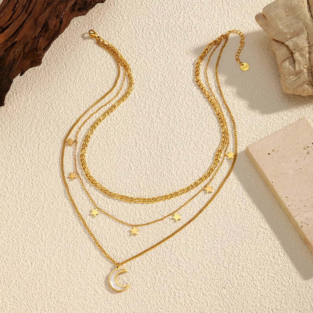 18K gold-plated three-layer moon necklace with delicate chains and celestial moon charms, featuring a stylish layered design.