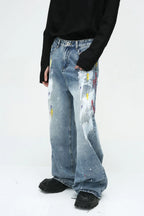 Blue denim painting jeans with pockets from Plush Fashion Shop, showing detailed design and classic five-pocket style.