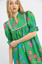 Umgee multi flower print V-neck dress featuring a flowy silhouette and vibrant floral pattern.