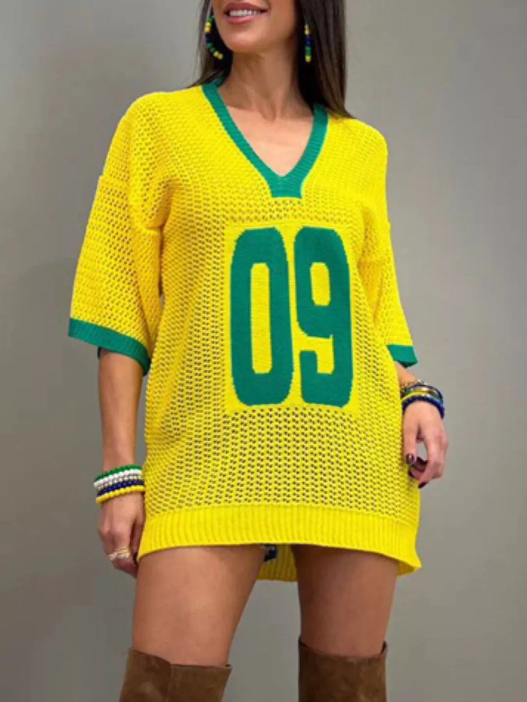 Women's oversized V-neck openwork sweater by Trendsi, lightweight knit pullover with a relaxed fit and stylish openwork design.