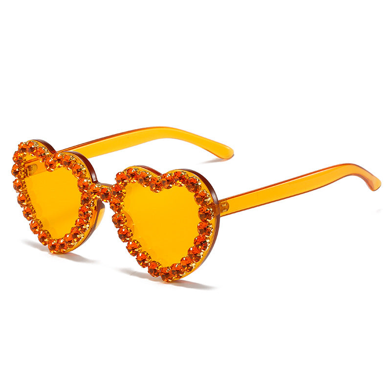 Peach heart-shaped rhinestone sunglasses by Plush Fashion Hub featuring Y2K INS style eye wear with sparkling rhinestone details.