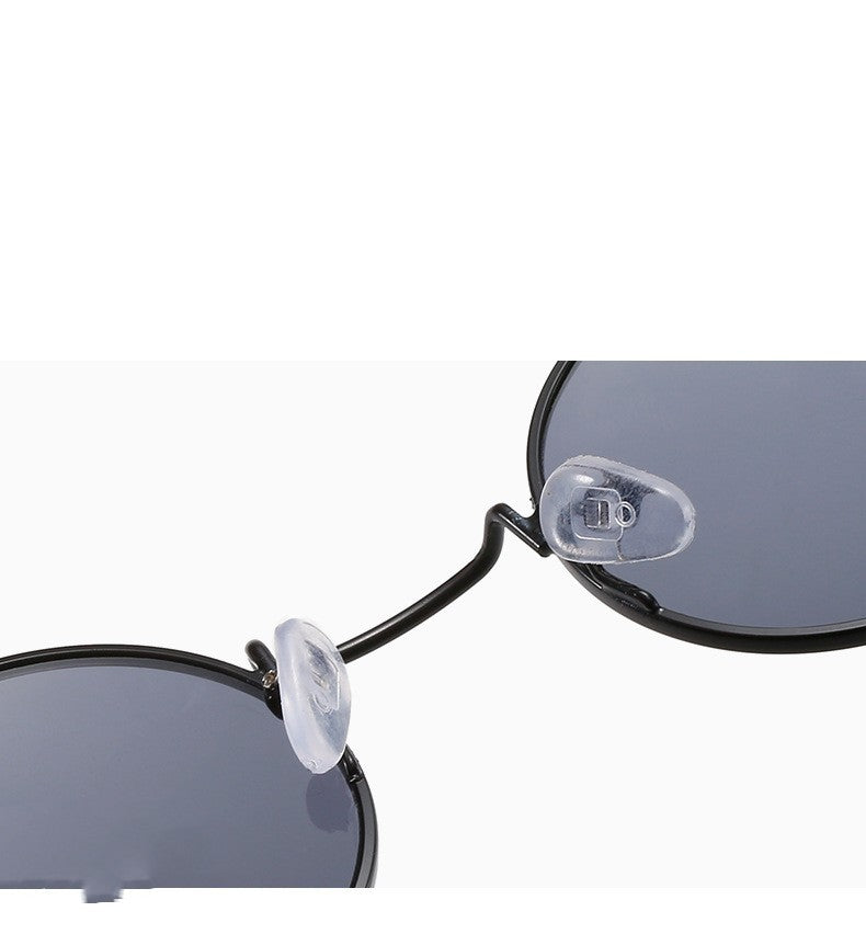 Retro round gothic sunglasses by FitiqueFit with steampunk-inspired design and metal frames, perfect for vintage fashion styles.