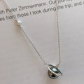 Planet Pearl Pendant Necklace by Shopimist featuring a shimmering pearl pendant on a delicate chain.