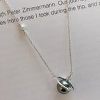 Planet Pearl Pendant Necklace by Shopimist featuring a shimmering pearl pendant on a delicate chain.