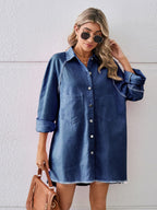 VYSN raw hem button-up denim dress hanging on a wooden hanger, showcasing casual fashion style and distressed denim details.