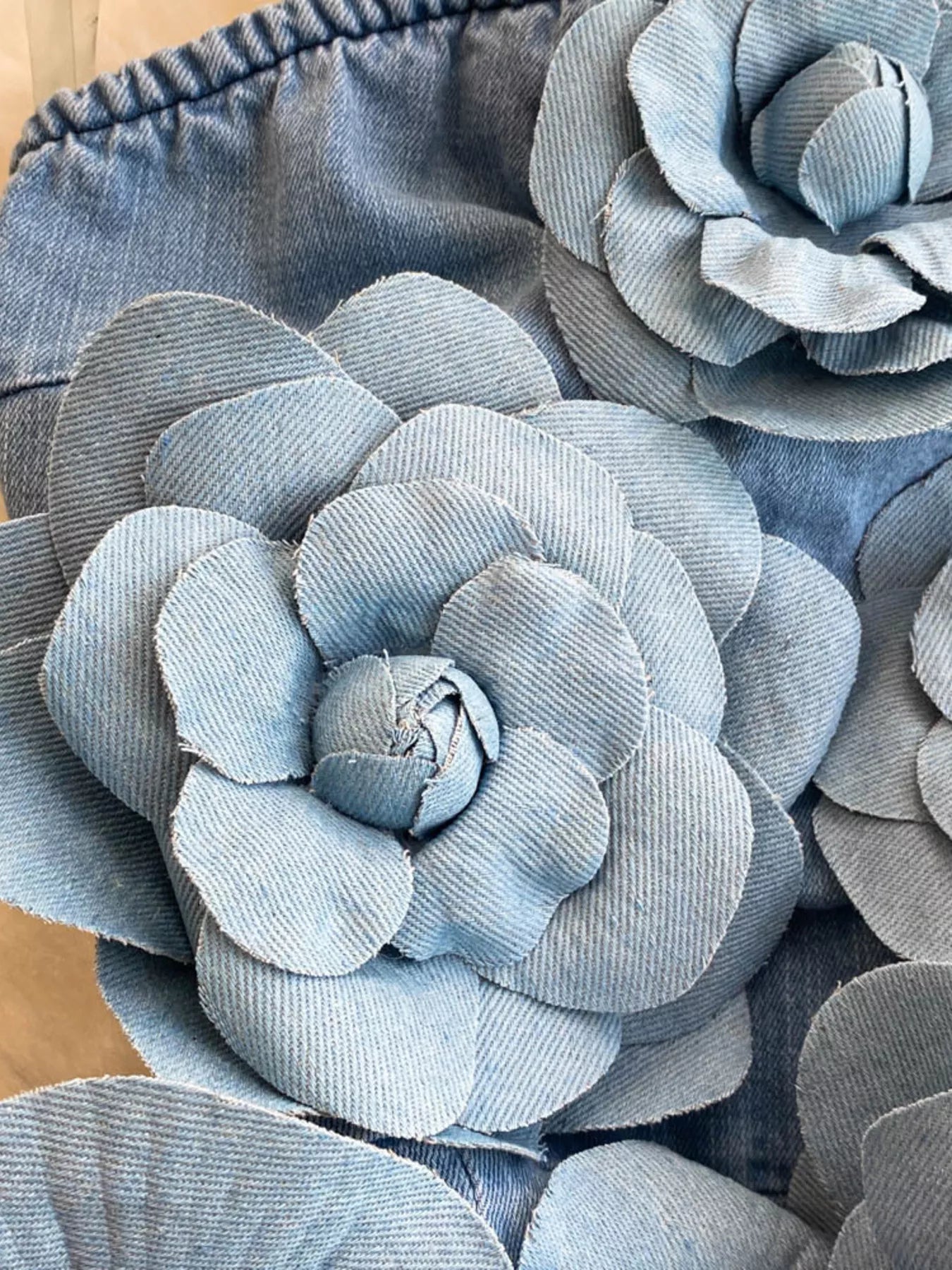Strapless denim dress with floral appliqué details from Trendsi, featuring a fitted bodice and casual summer style.