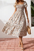Women's square neck ruffle sleeve smocked midi dress made from cotton blend, stylish and comfortable, by Plush Fashion Hub.