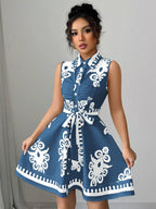 Sleeveless ruched printed tie waist dress by Shopimist, featuring a stylish pattern and flattering silhouette.