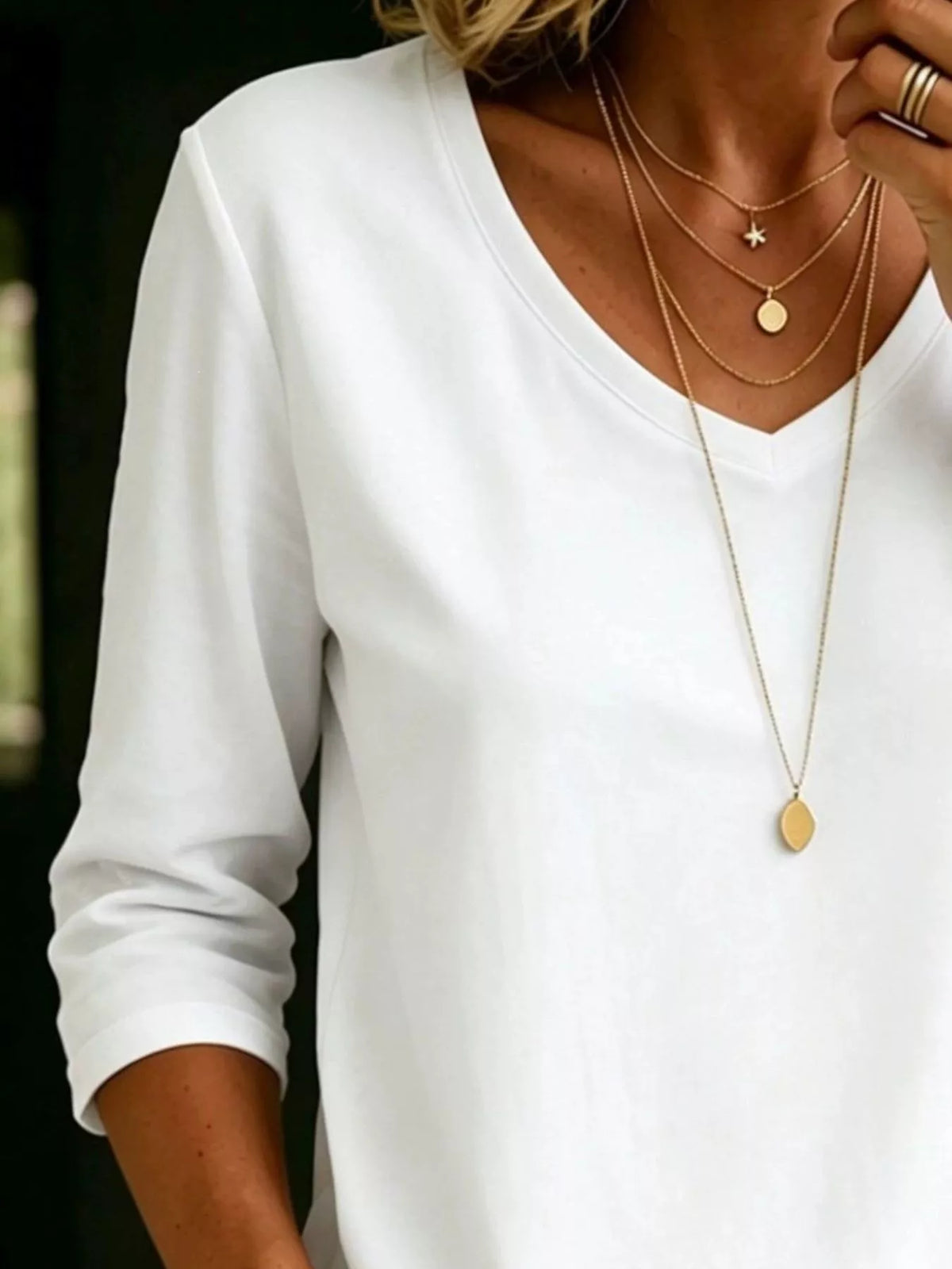 Plus size V-neck 3/4 sleeve T-shirt from Trendsi, featuring a comfortable fit and casual style in a full-size top.