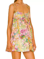 Floral print tie-shoulder mini dress from Trendsi featuring a vibrant floral pattern and a stylish tie-shoulder design.