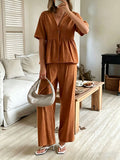 Women's FitiqueFit casualwear set with V-neck loose short-sleeve top and wide-leg pants, shown in a relaxed fit and soft fabric.