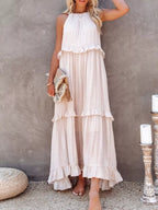 Ruffled tiered sleeveless maxi dress by Plush Fashion Hub featuring flowing fabric and layered ruffle details.