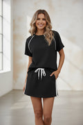 Women's drawstring short-sleeve top and mini skirt set by FitiqueFit, featuring a casual, coordinated clothing ensemble.