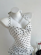 Polka dot halter neck cami top by Plush Fashion Hub featuring a stylish sleeveless design and playful polka dot pattern.