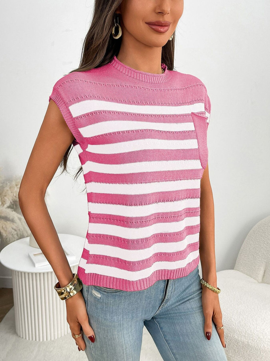 Women's striped knit cap sleeve sweater with pocket detail, featuring a cozy outerwear style from Trendsi.