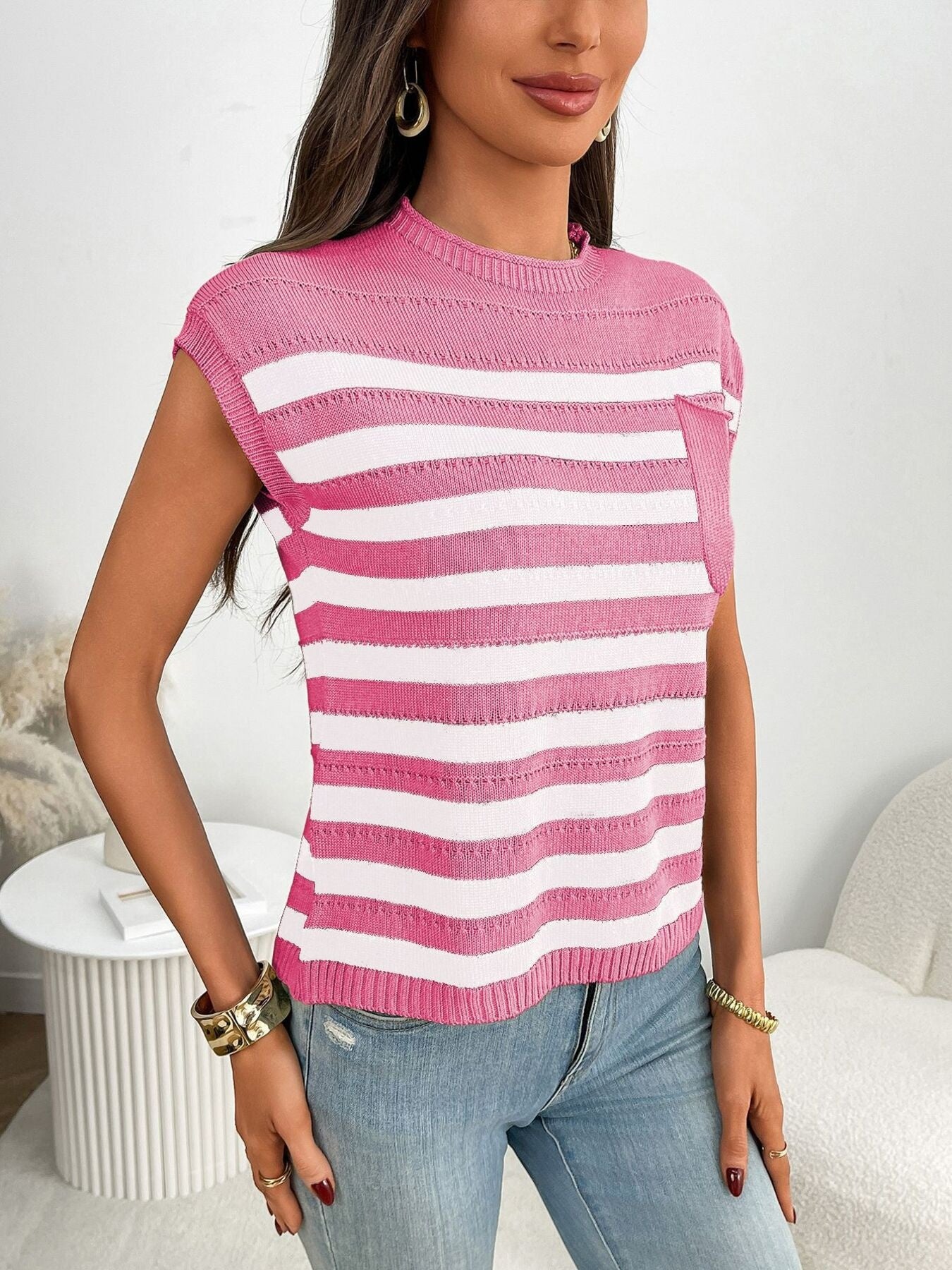 Women's striped knit cap sleeve sweater with pocket detail, featuring a cozy outerwear style from Trendsi.