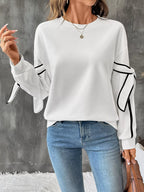 Trendsi side striped round neck sweatshirt featuring a casual fit, long sleeves, and contrasting stripe details on the sleeves.