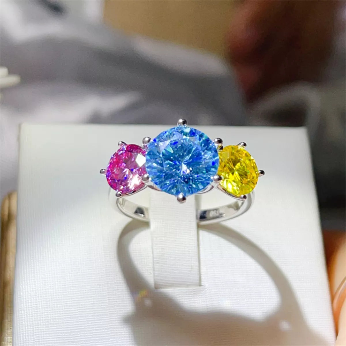 Sterling silver ring featuring a 5-carat moissanite gemstone, showcasing a sparkling, elegant jewelry piece with a sleek band.