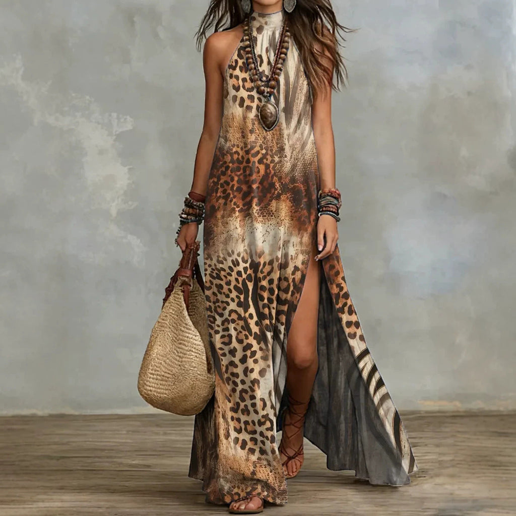 Women's sleeveless floral print maxi dress by FitiqueFit, featuring a split design and flowing fabric for a stylish summer look.